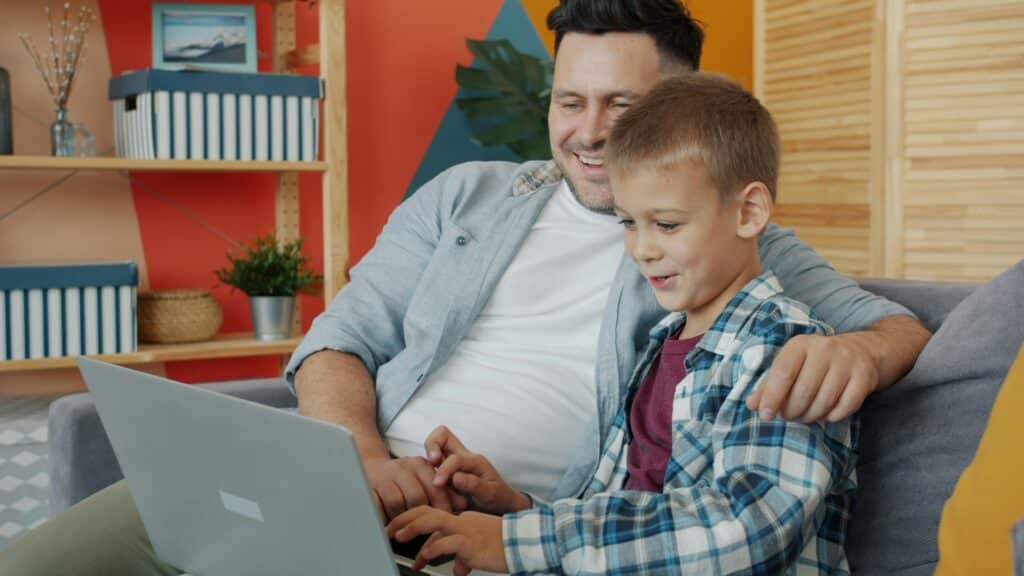 Parent and child using screen time app on tablet together with calm, balanced approach to ADHD management